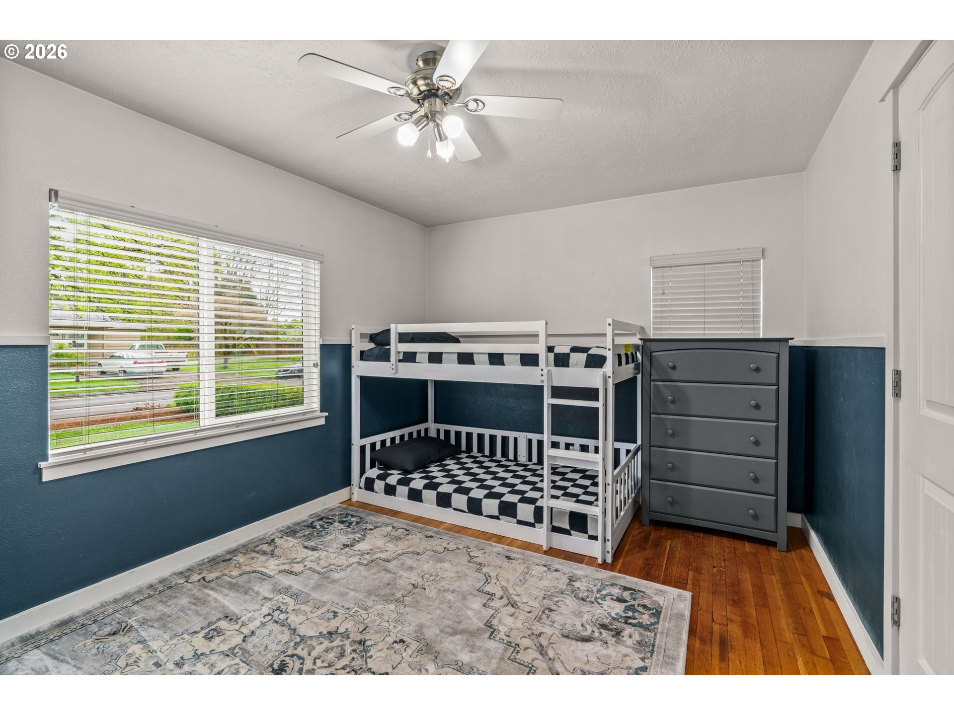 3155 Bell Avenue Eugene, OR 97402 - Photo 16 of 30 a bedroom with a bed and a chandelier