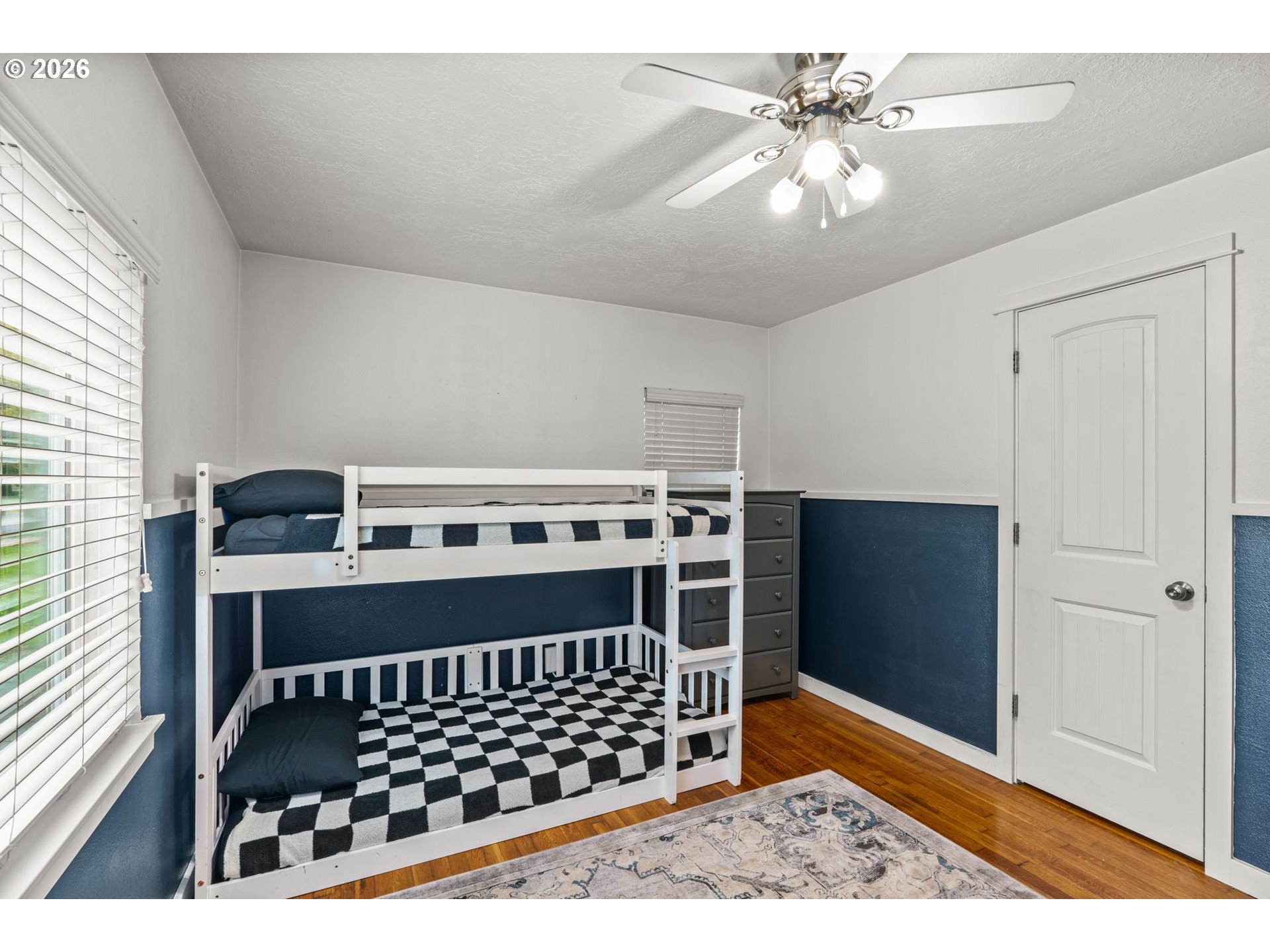 3155 Bell Avenue Eugene, OR 97402 - Photo 17 of 30 a bedroom with a bed and a chandelier