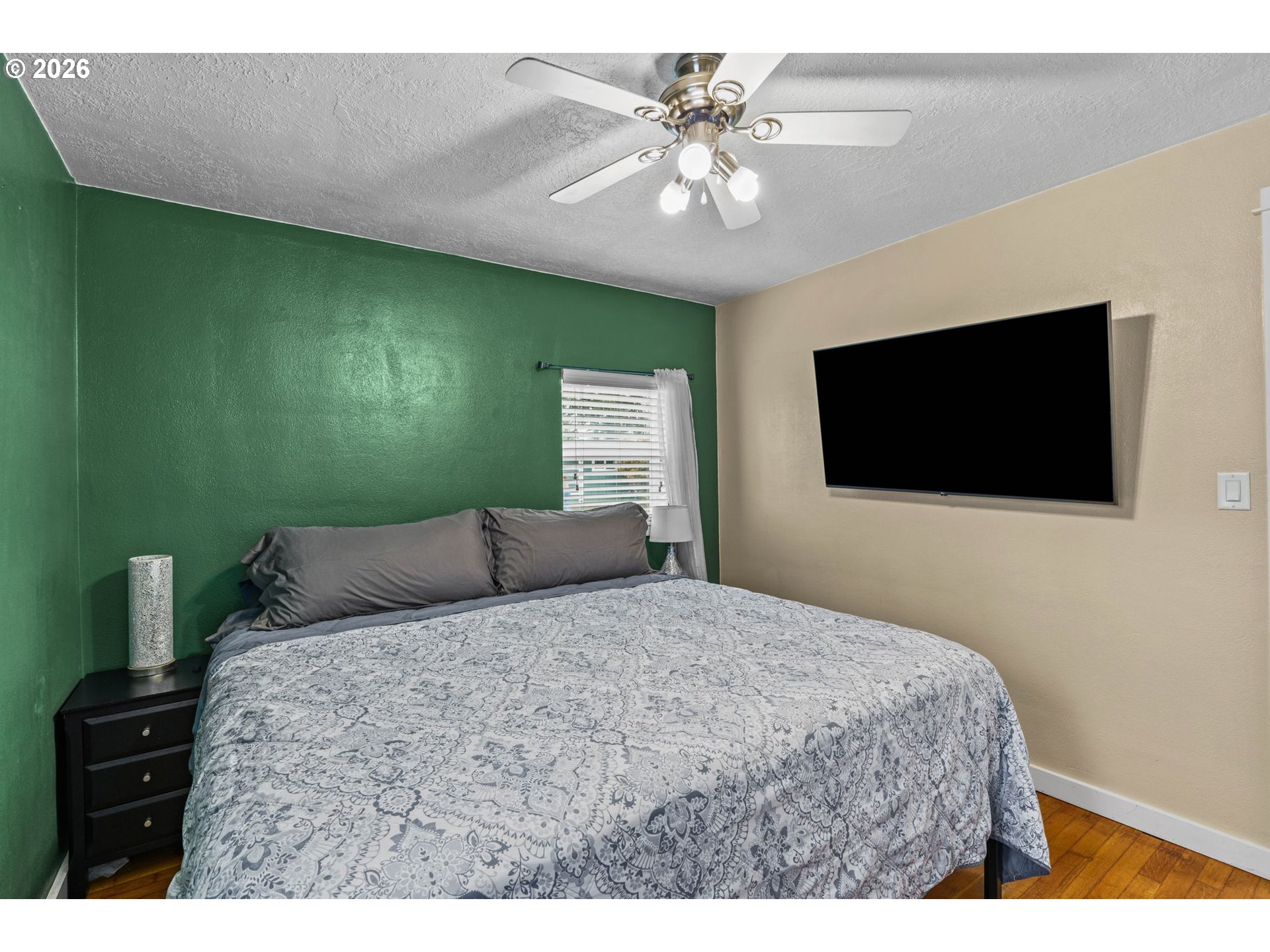 3155 Bell Avenue Eugene, OR 97402 - Photo 20 of 30 a bedroom with a bed and a flat screen tv