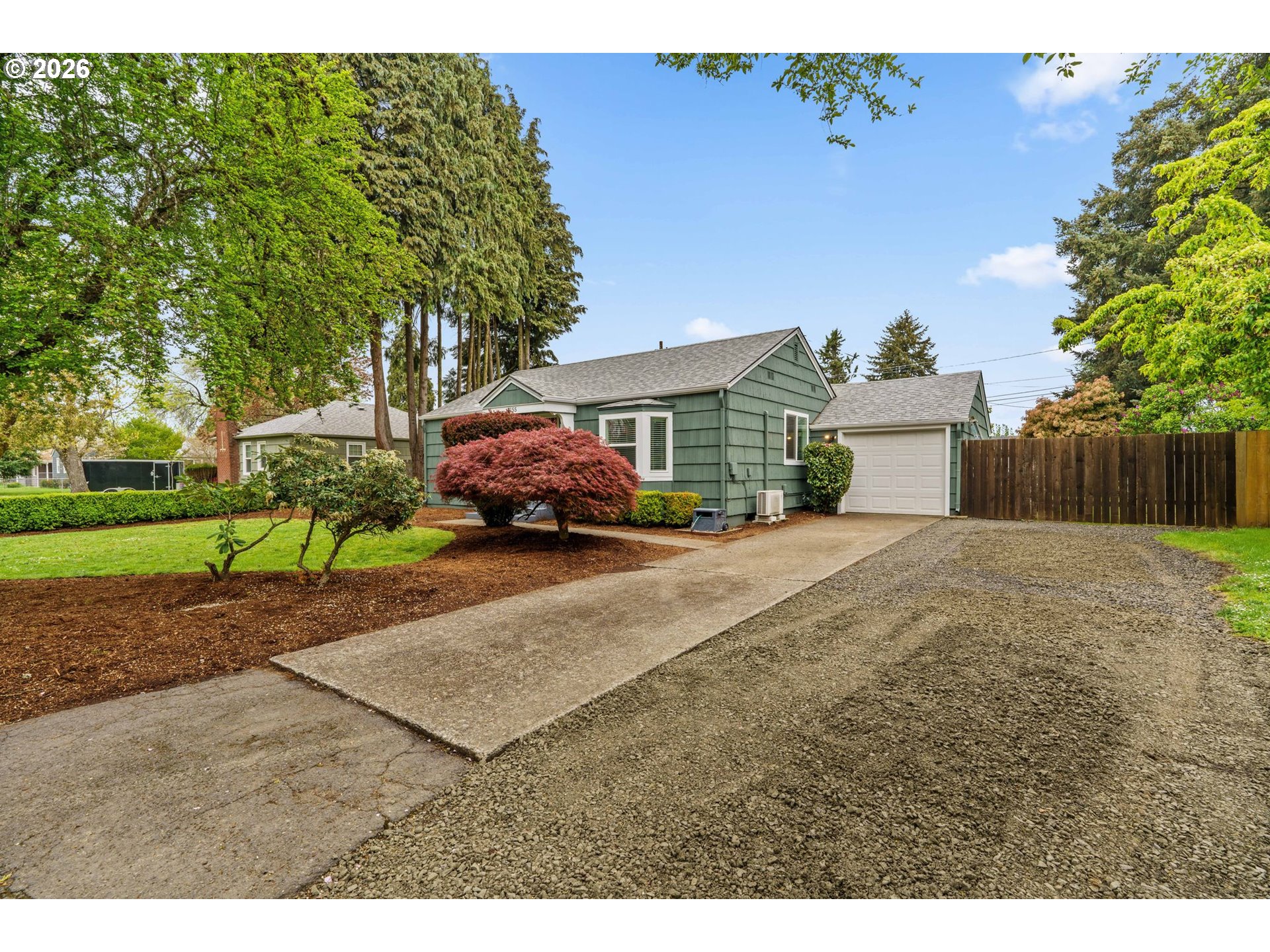 3155 Bell Avenue Eugene, OR 97402 - Photo 3 of 30 a front view of a house with a yard and a garage