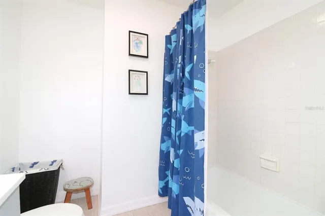 a bathroom with a shower and a toilet