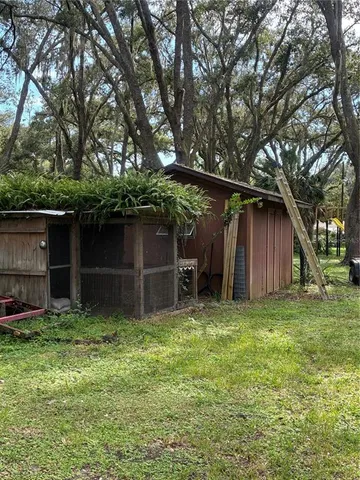 a backyard of a house with lots of green space