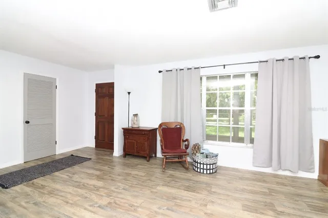 a room with a bed and a table in it