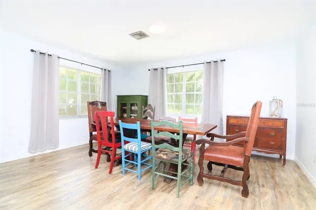 a view of a dining room with furniture window and outside view