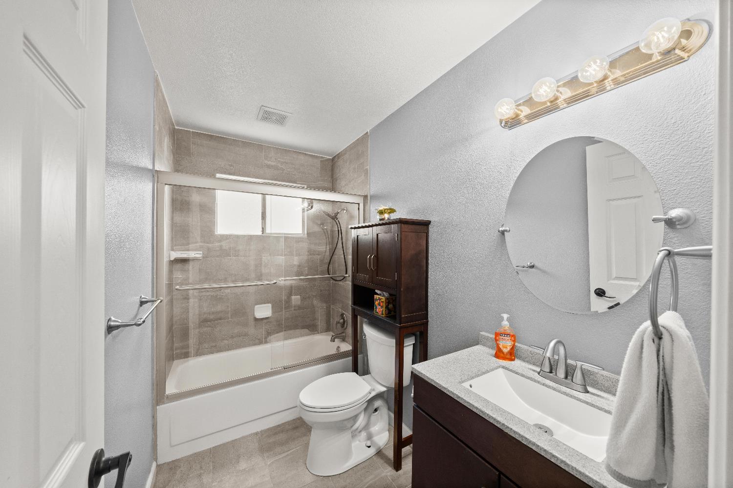 2768 Butte House Road Yuba City, CA 95993 - Photo 23 of 43 a bathroom with a sink toilet and shower