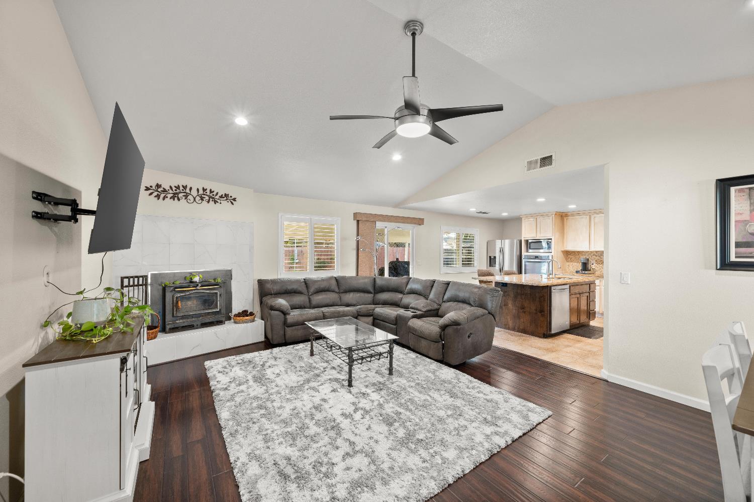 2768 Butte House Road Yuba City, CA 95993 - Photo 3 of 43 a living room with fireplace furniture and a wooden floor