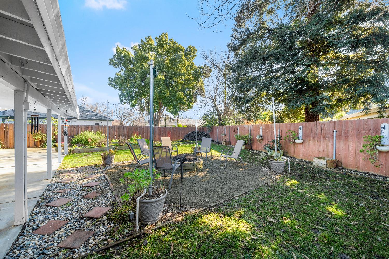 2768 Butte House Road Yuba City, CA 95993 - Photo 35 of 43 a view of a backyard with plants and a patio