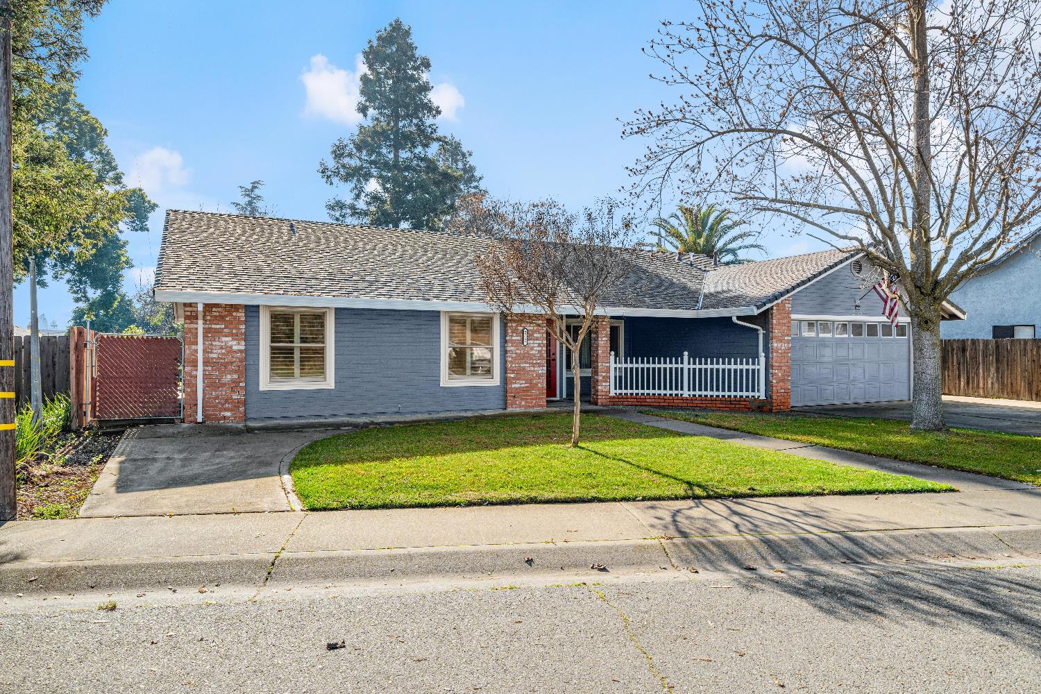 2768 Butte House Road Yuba City, CA 95993 - Photo 39 of 43 a front view of a house with a yard and garage