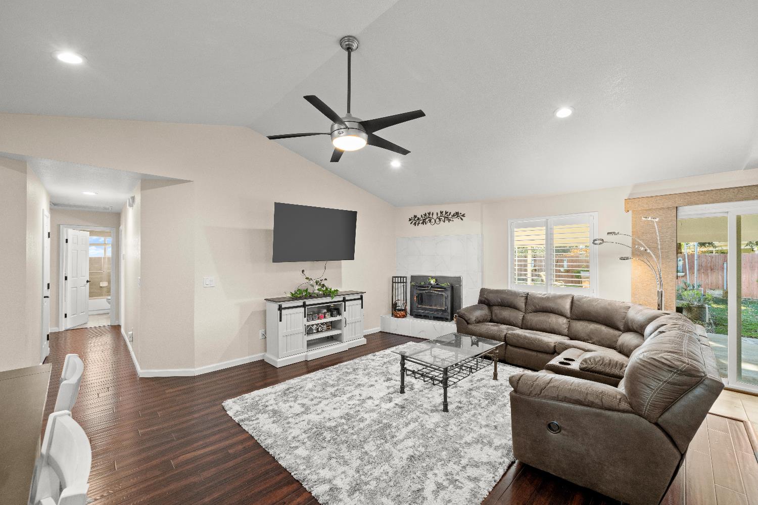 2768 Butte House Road Yuba City, CA 95993 - Photo 10 of 43 a living room with furniture a flat screen tv and wooden floor