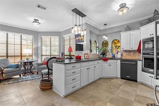 a kitchen with sink refrigerator and window