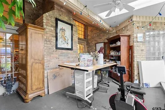 a view of a workspace with furniture