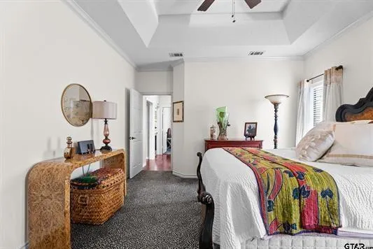 a bed room with a bed a couch and dresser