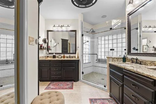 a bathroom with a sink a vanity and a mirror
