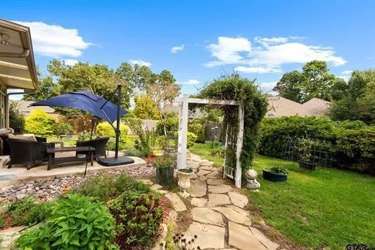 a view of a swimming pool with a patio