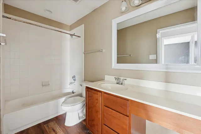 a bathroom with a sink a toilet and a bathtub