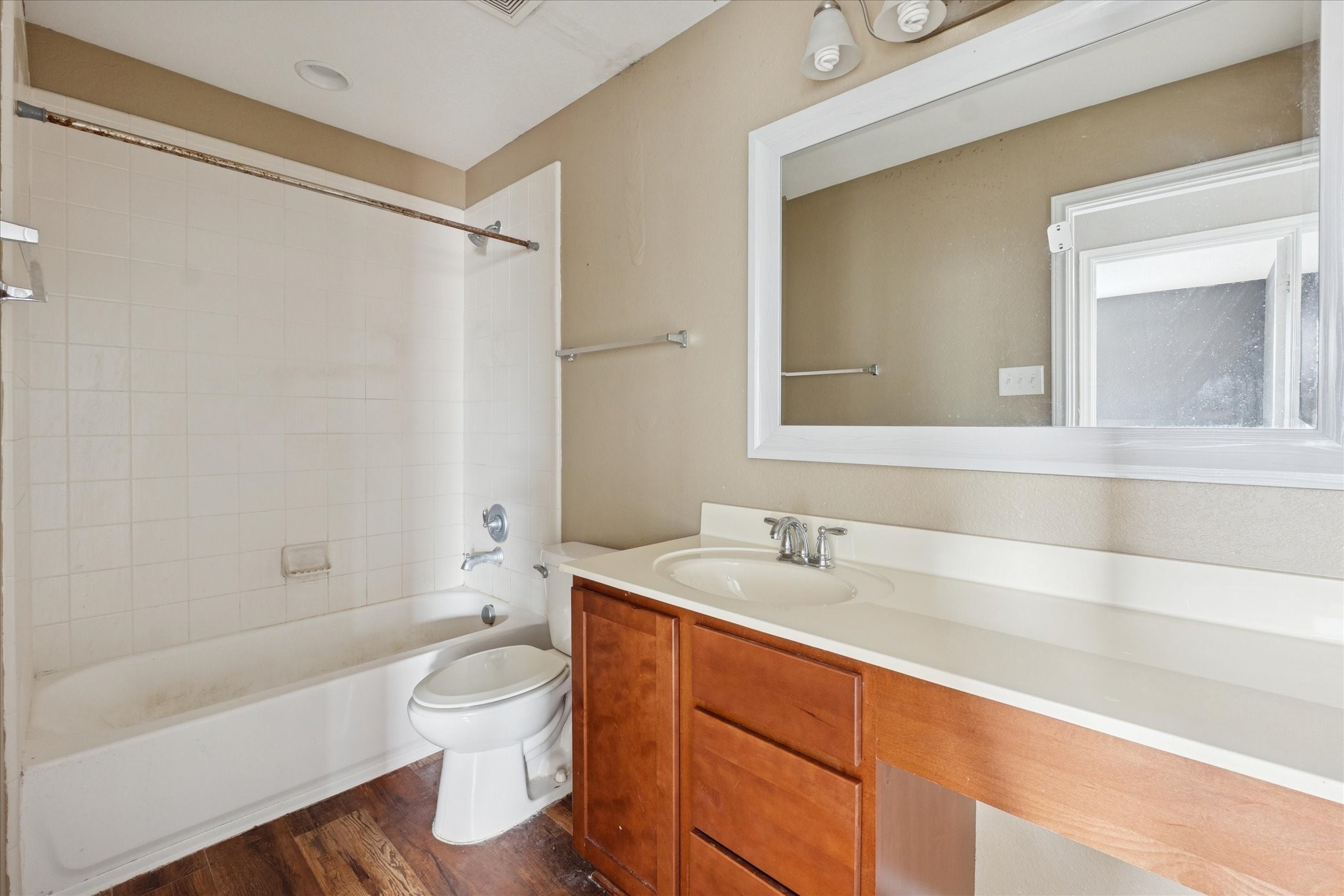 6630 San Miguel Way Converse, TX 78109 - Photo 13 of 14 a bathroom with a sink a toilet and a bathtub