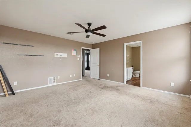 a view of a big room with carpet