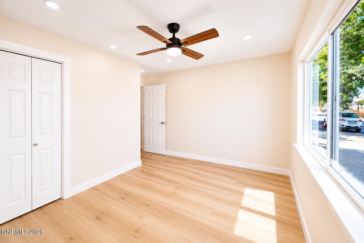 742 Ruth Street Carson City, NV 89701 - Photo 19 of 25 a view of a big room with wooden floor and windows