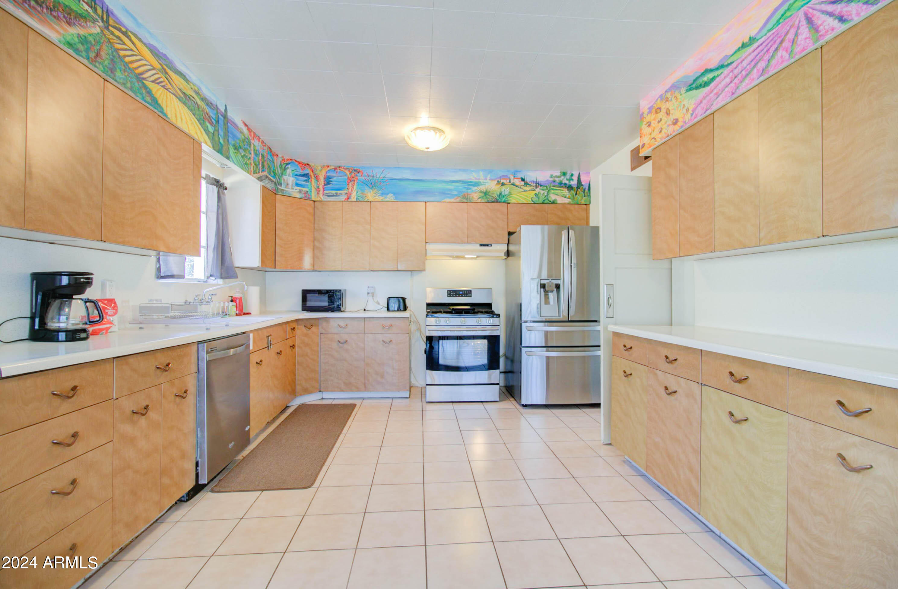 877 East Sycamore Street Globe, AZ 85501 - Photo 15 of 51 a kitchen with stainless steel appliances a sink and a refrigerator
