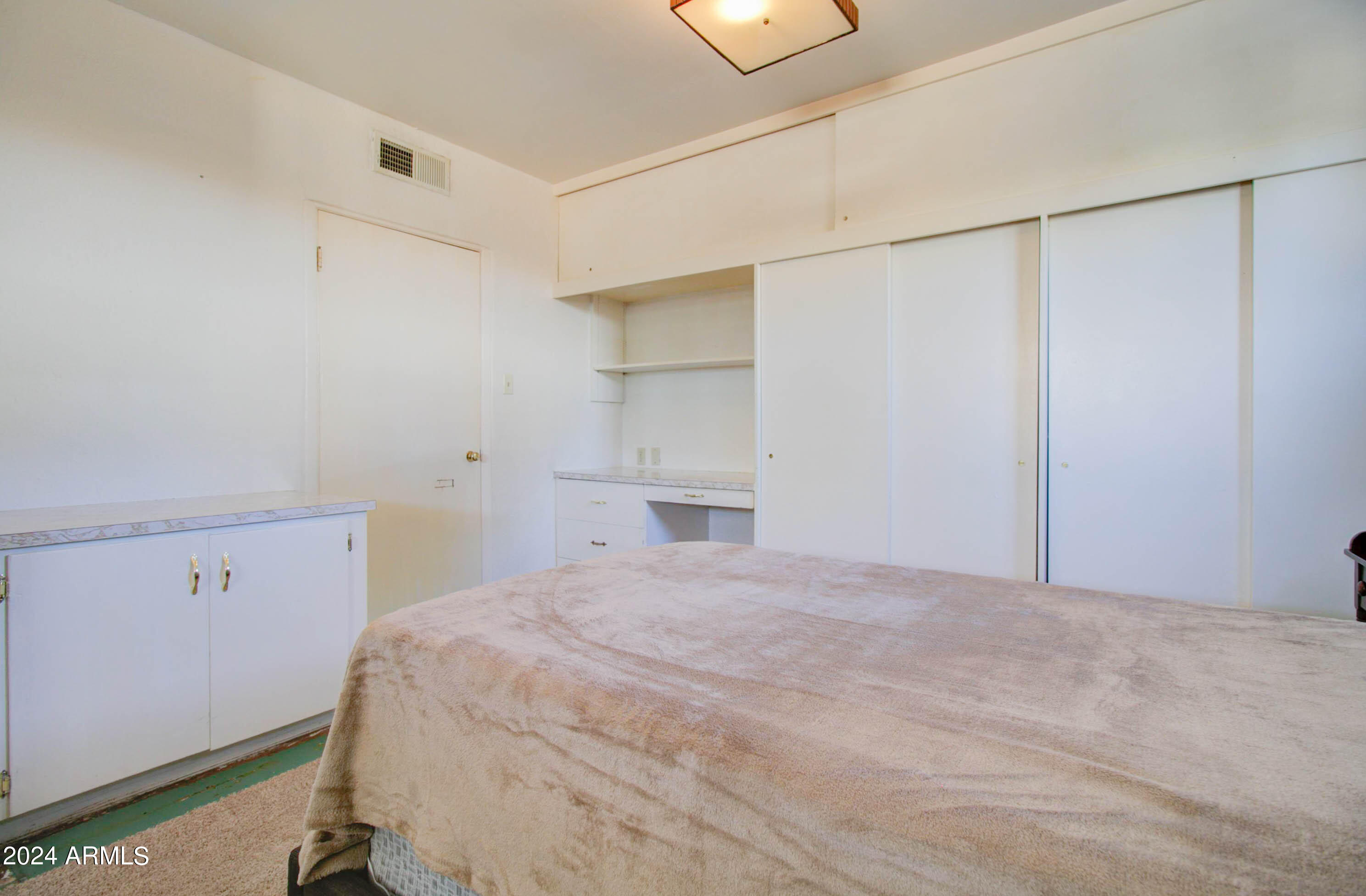 877 East Sycamore Street Globe, AZ 85501 - Photo 30 of 51 a bedroom with a bed and a window