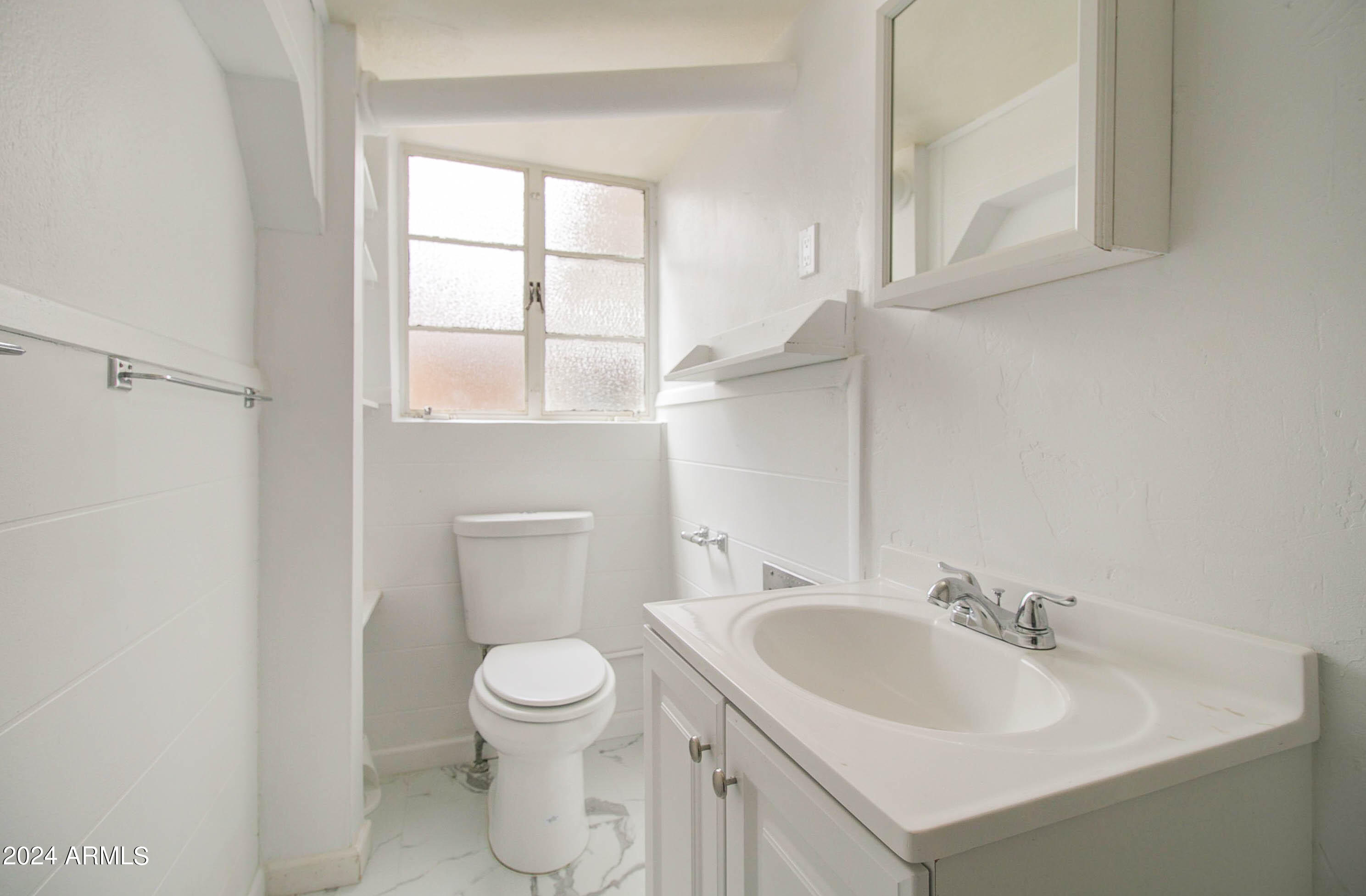 877 East Sycamore Street Globe, AZ 85501 - Photo 45 of 51 a bathroom with a sink a toilet and a mirror