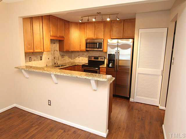 5546 Hamstead Crossing Raleigh, NC 27612 - Photo 7 of 17 Brand new customized Kitchen with Granite countertops, stone tile backsplash, gourmet faucet, and all stainless appliances