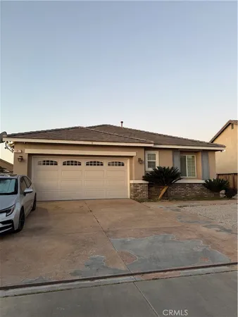 a view of house and car parked