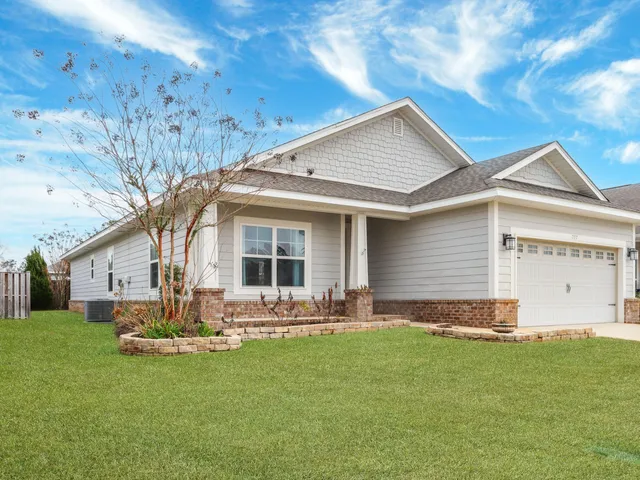 a front view of house with yard outdoor seating and barbeque oven