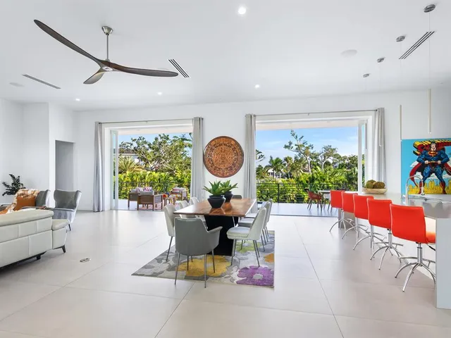 a bathroom with a granite countertop shower a sink and a mirror