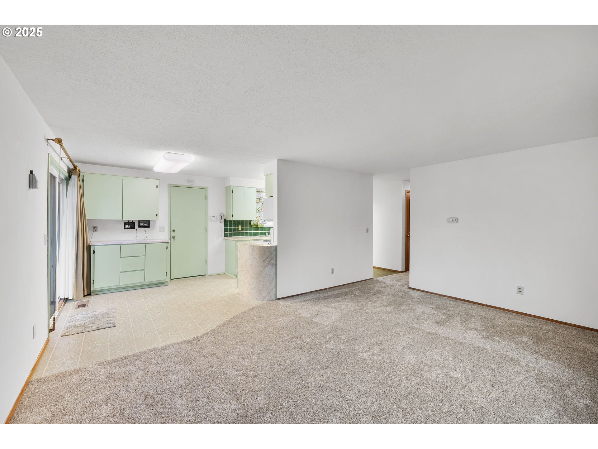 15916 Southeast Brooklyn Street Portland, OR 97236 - Photo 11 of 24 a view of a big room with wooden cabinet and windows