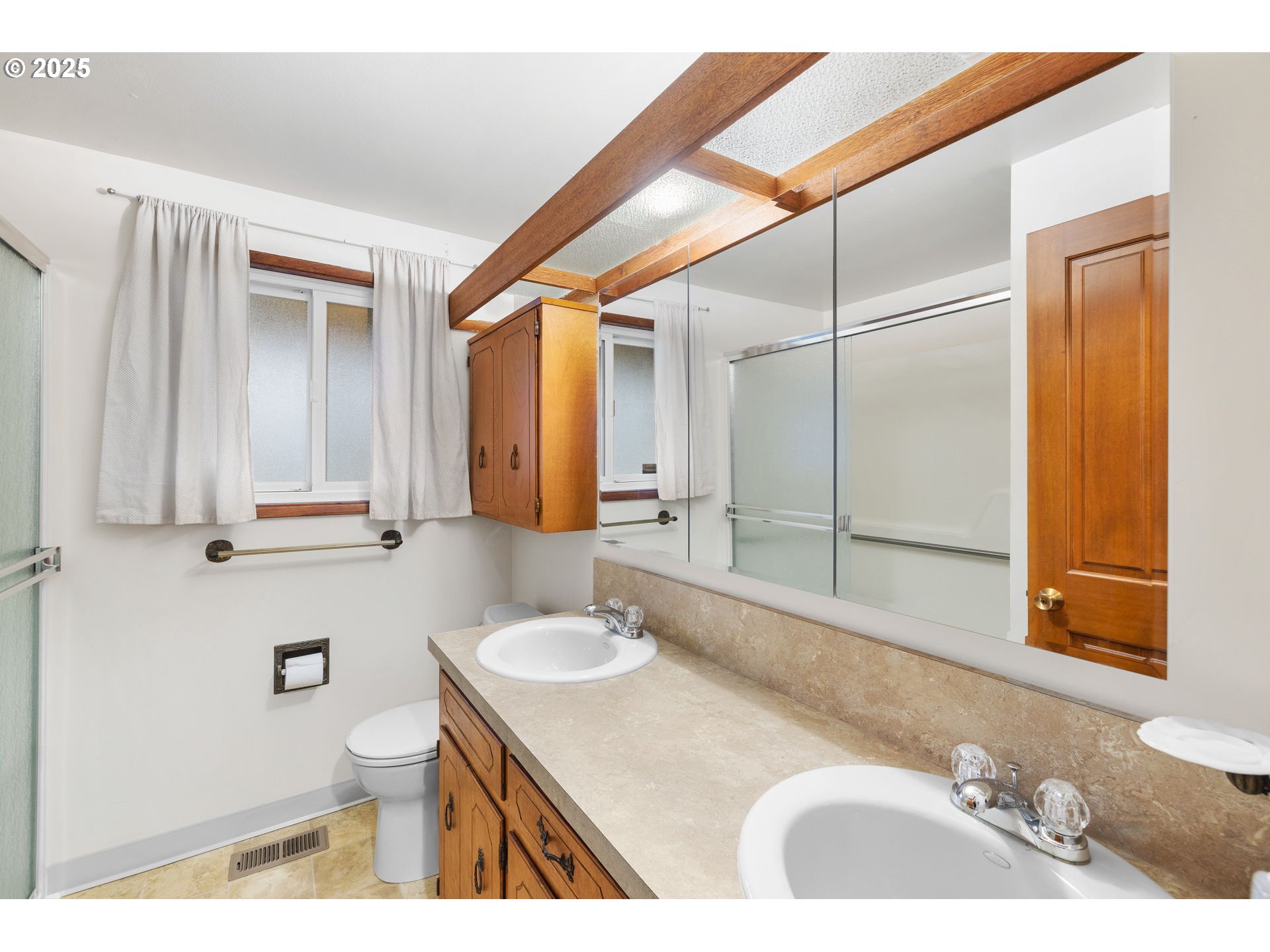 15916 Southeast Brooklyn Street Portland, OR 97236 - Photo 18 of 24 a bathroom with a sink and a mirror