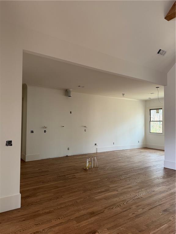 1040 Oak Valley Road Greensboro, GA 30642 - Photo 11 of 20 a view of an empty room with wooden floor and a window