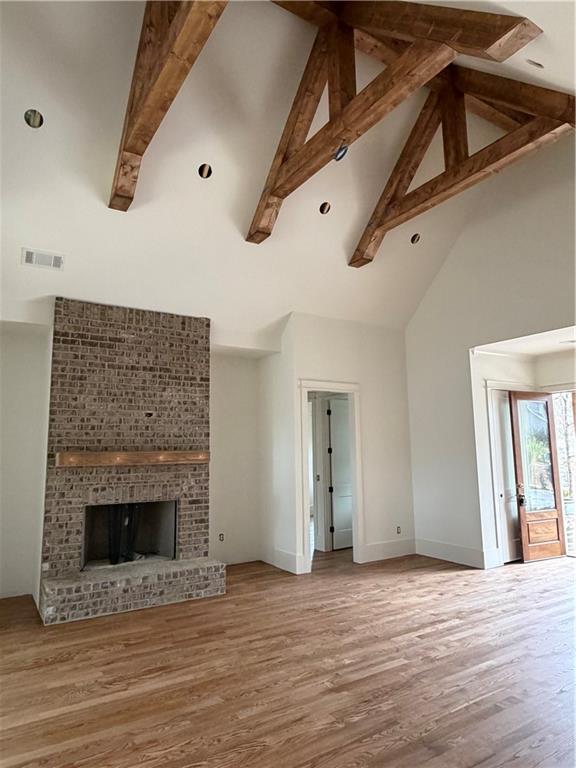 1040 Oak Valley Road Greensboro, GA 30642 - Photo 7 of 20 a view of an empty room with wooden floor and a window