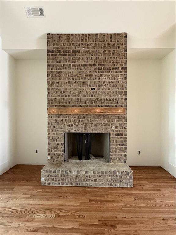 1040 Oak Valley Road Greensboro, GA 30642 - Photo 8 of 20 a view of fireplace and wooden floor