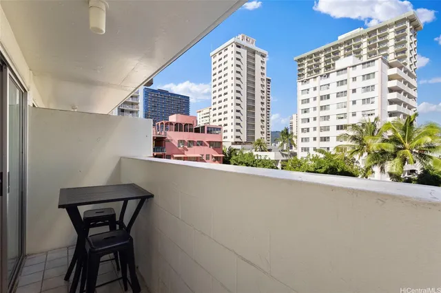 a table and chairs in a room next to a window