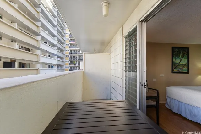 a view of a balcony with wooden floor and stairs