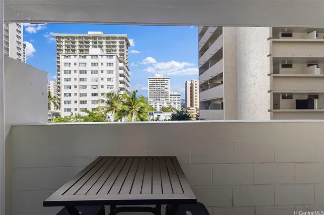 a view of balcony with wooden floor