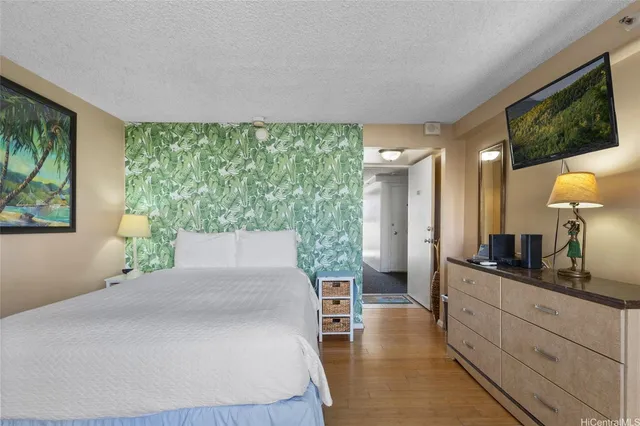 a living room with large couches and large flat screen tv