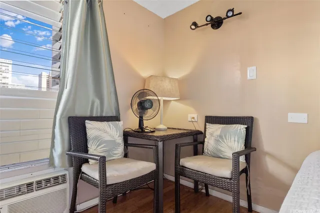 a view of a room with a table and chairs