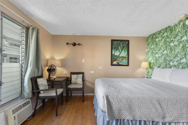 a bedroom with a bed and a table