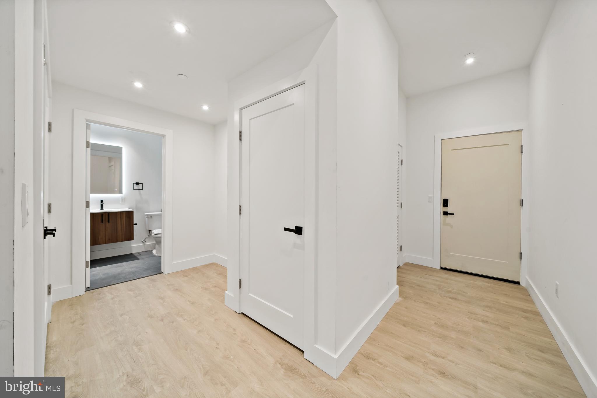 326 North 12th Street, Unit 405 Philadelphia, PA 19107 - Photo 20 of 22 a view of a hallway with wooden floor