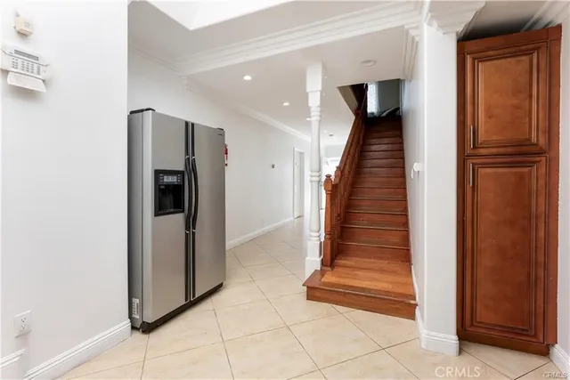 a view of entryway and hall with a door