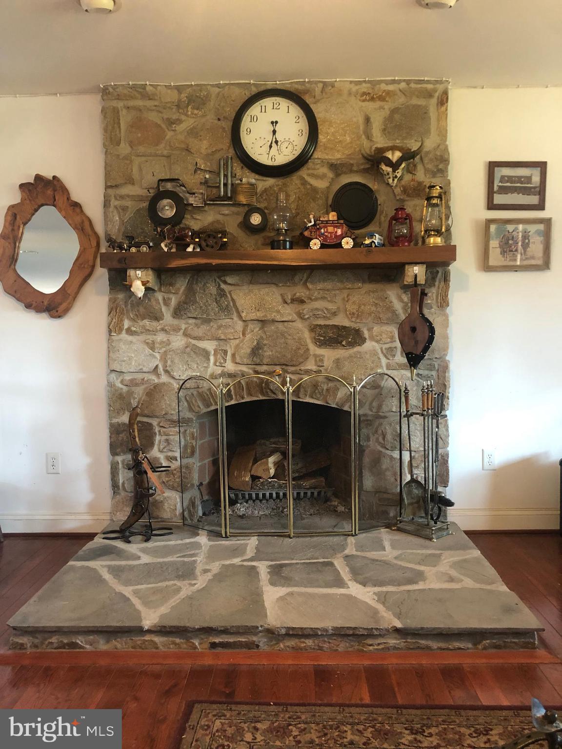 12550 Shoemaker Road Taneytown, MD 21787 - Photo 18 of 40 a view of a fireplace with a clock on it