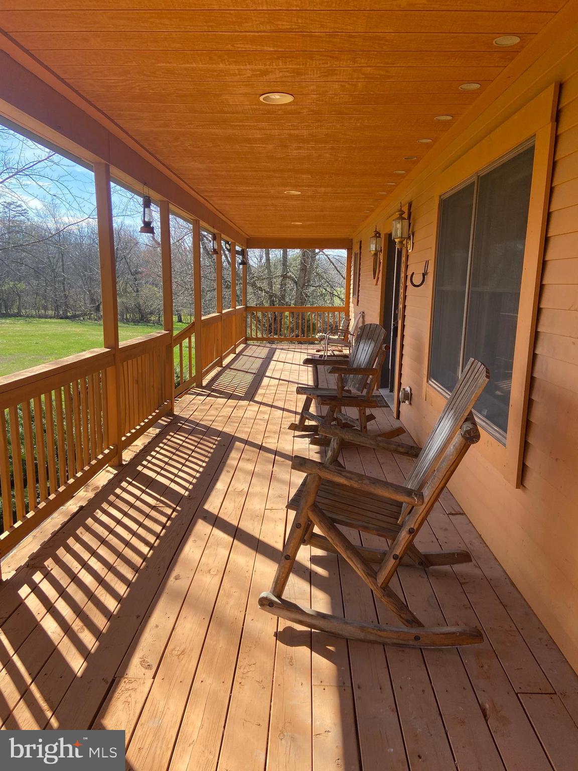 12550 Shoemaker Road Taneytown, MD 21787 - Photo 2 of 40 a view of a balcony with wooden floor