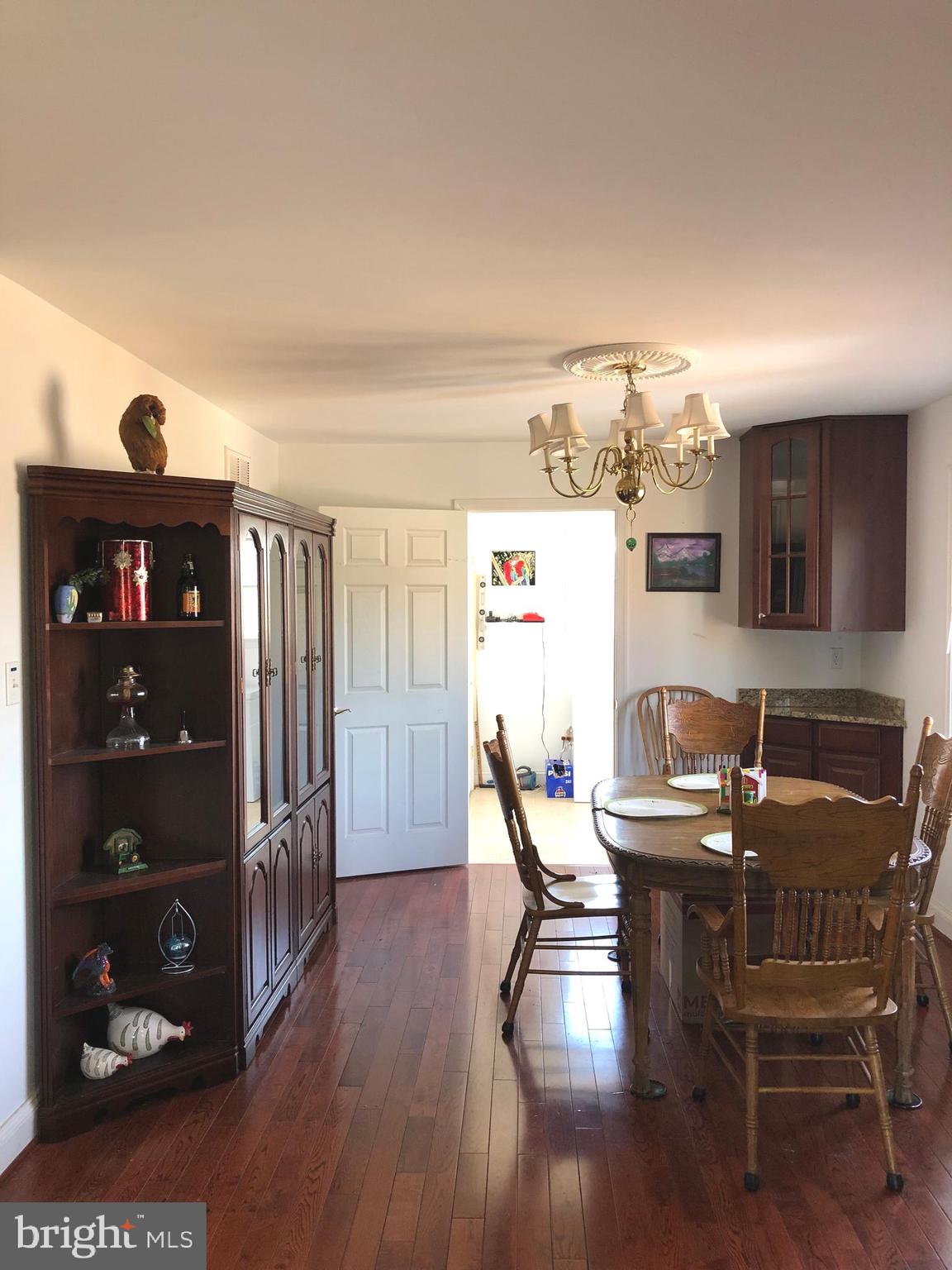12550 Shoemaker Road Taneytown, MD 21787 - Photo 23 of 40 a view of a dining room with furniture and wooden floor