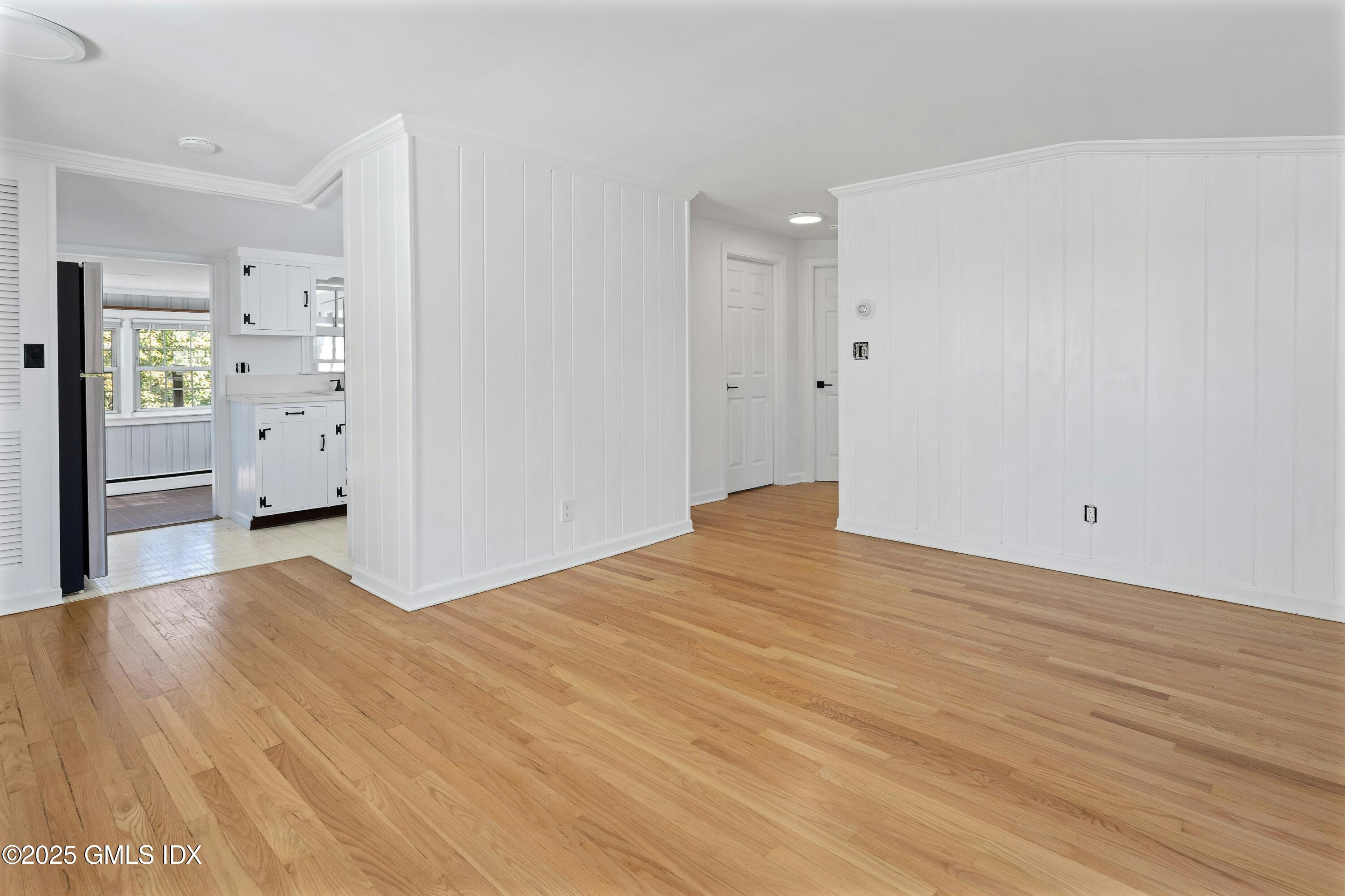 80 Victory Street, Unit B Stamford, CT 06902 - Photo 7 of 12 a view of empty room with wooden floor