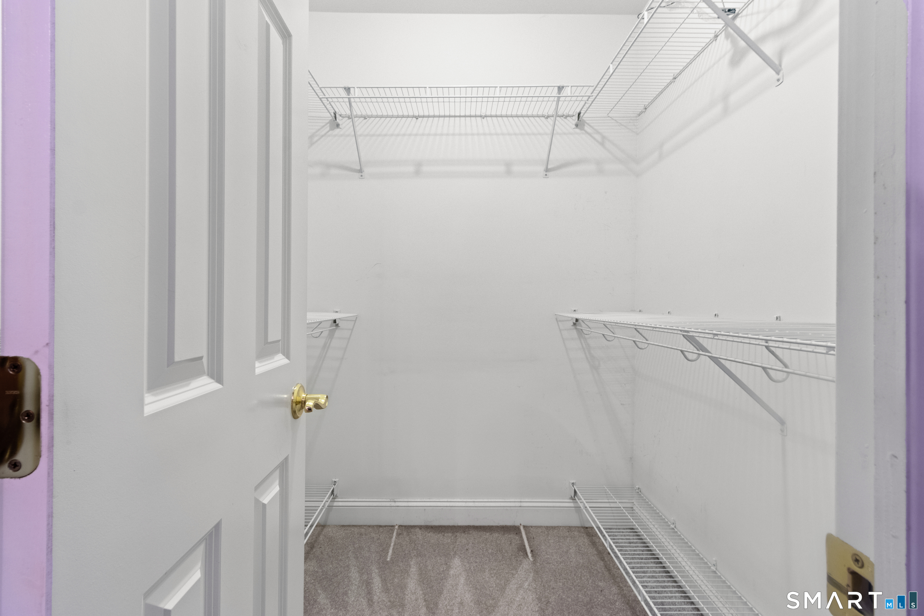 826 South Main Street Seymour, CT 06483 - Photo 14 of 27 a view of walk in closet with empty racks