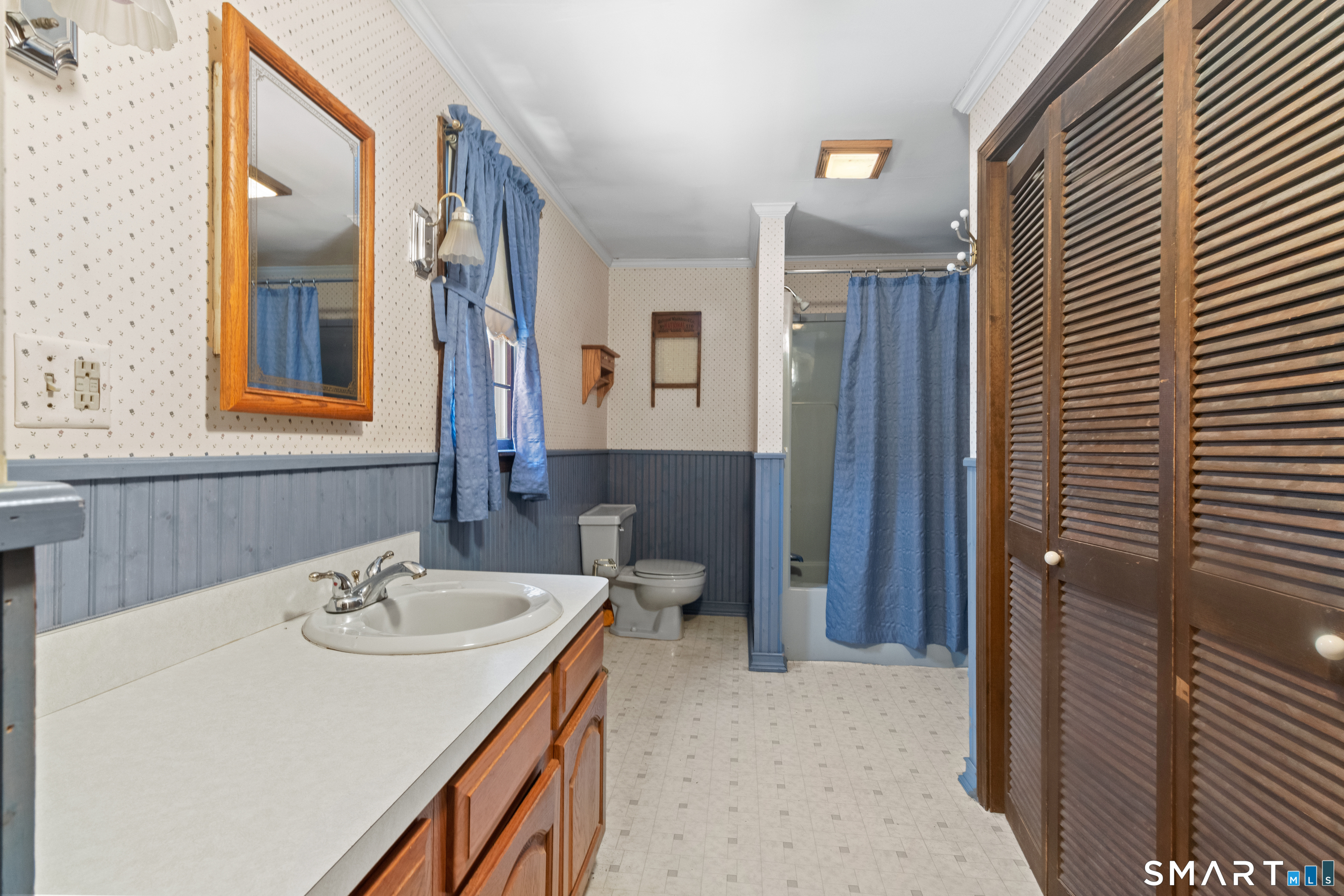 826 South Main Street Seymour, CT 06483 - Photo 20 of 27 a bathroom with a sink and a mirror