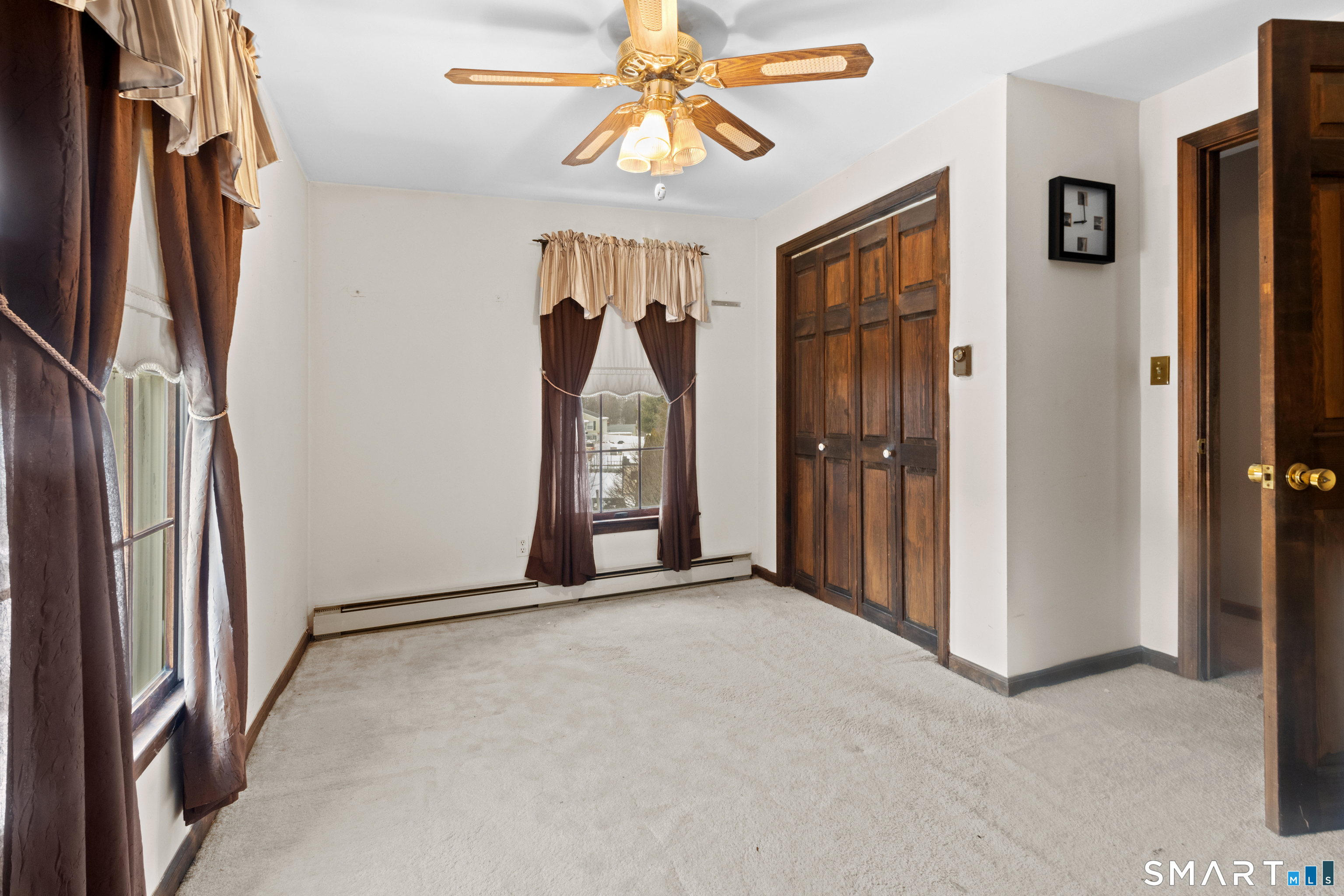 826 South Main Street Seymour, CT 06483 - Photo 21 of 27 a view of a hallway with a chandelier fan and kitchen view
