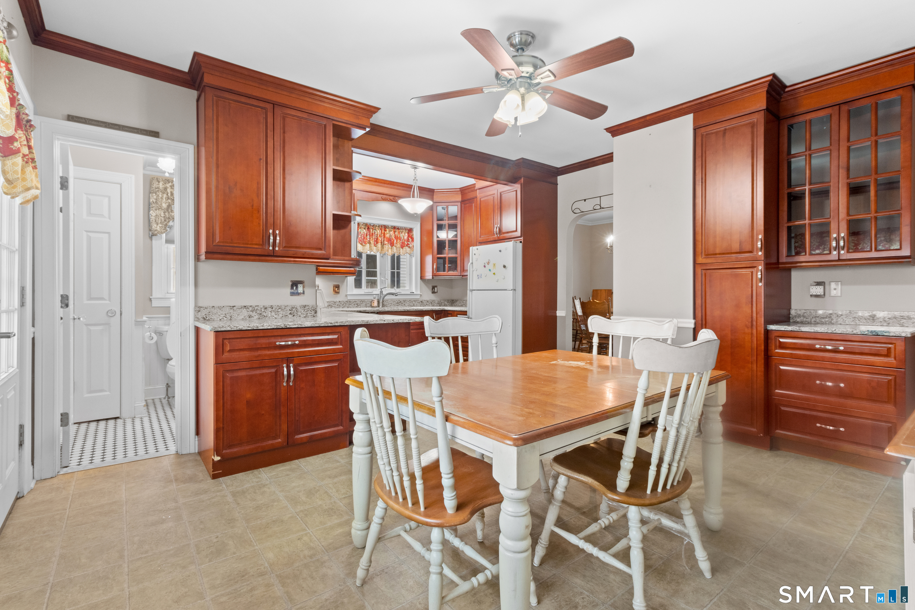 826 South Main Street Seymour, CT 06483 - Photo 5 of 27 a dining room with a wooden table and chairs